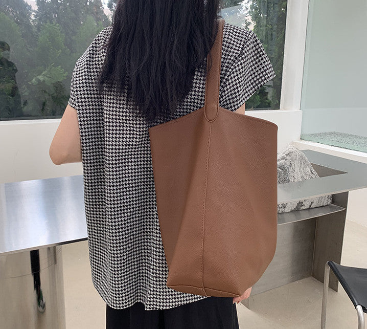 Casual leather handbag with removable inner pouch