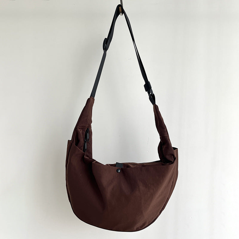 Black half moon purse with side gusset for expanded storage