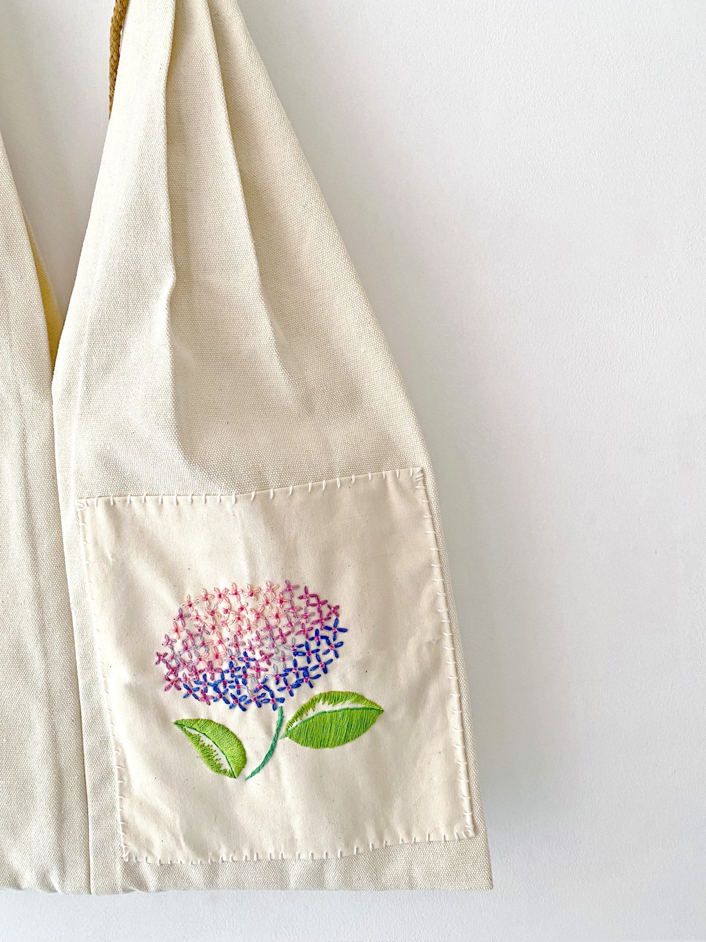 Floral embroidered canvas tote bag for the modern, eco-conscious shopper.