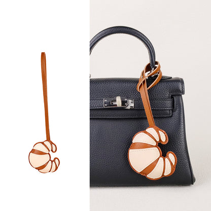 Scarf and tassel fashion piece suited to a handbag lover