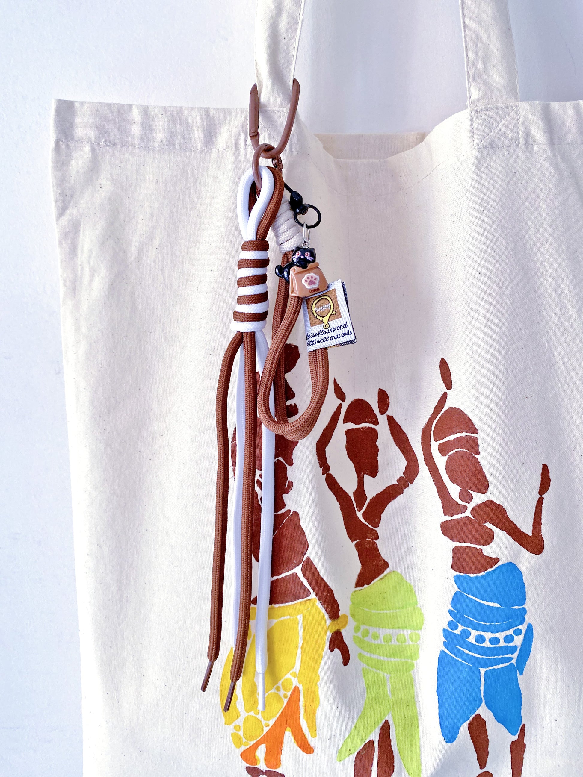 Minimalist oversized tote bag folded into a small square for easy travel.