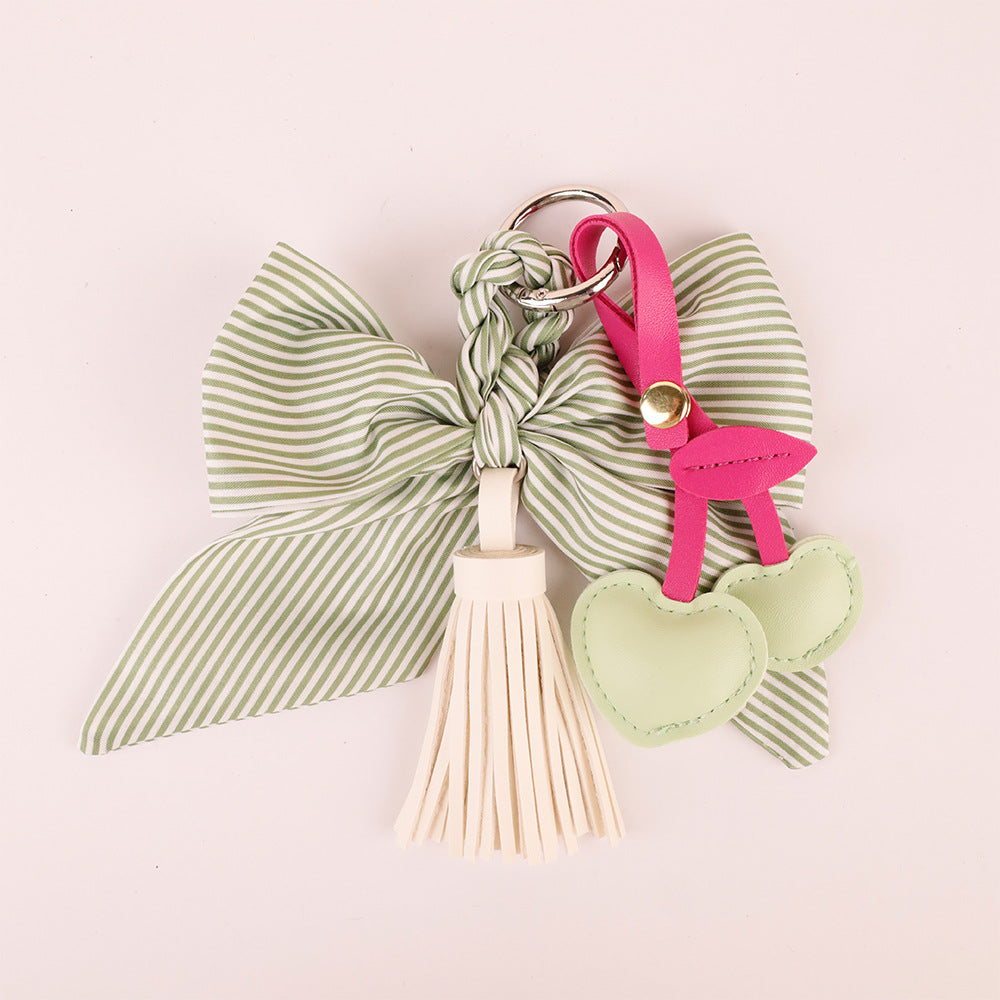 Custom handcrafted green ribbon bag pendant with tassel detail
