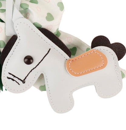 Cute animal charm with green fringe tassel on leather handbag handle