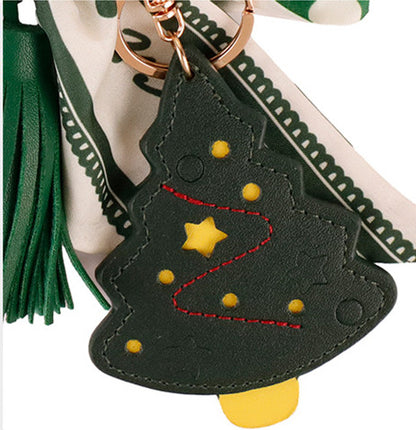 Handcrafted green silk style ribbon keychain styled with everyday purse
