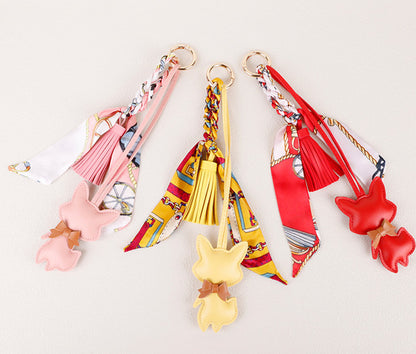 Fox keychain accessory displayed beside everyday personal items