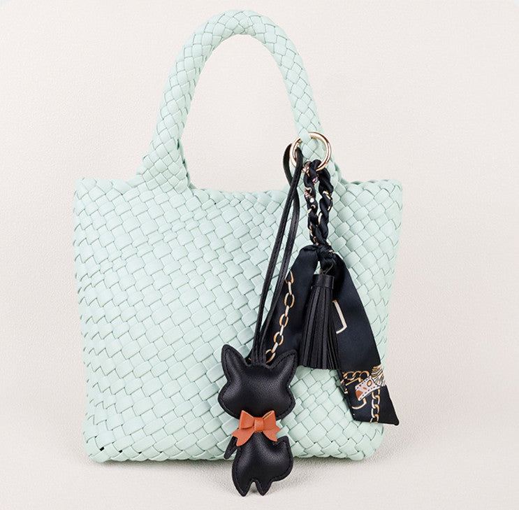 Small fox accessory with a flowing scarf and tassel detail