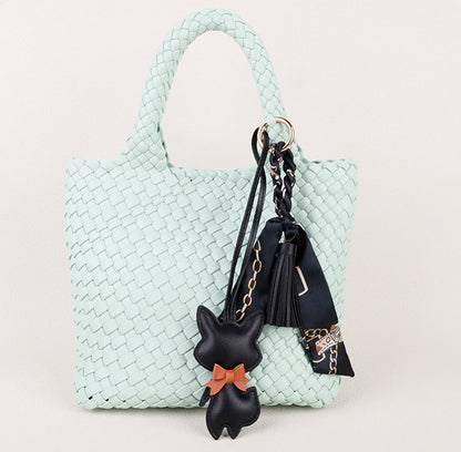 Small fox accessory with a flowing scarf and tassel detail