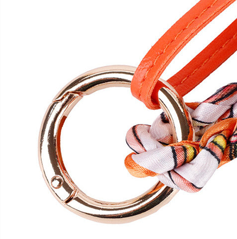 Cute woodland-inspired charm hanging from a travel tote