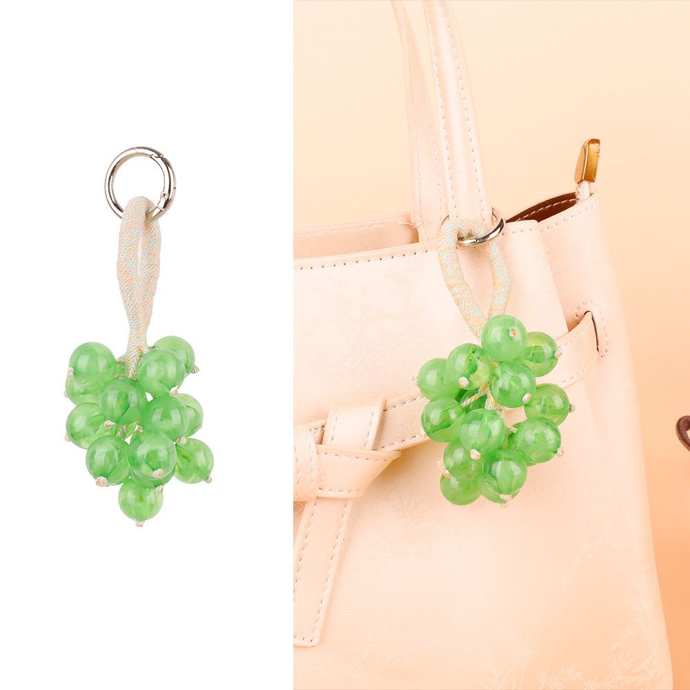 Three-dimensional fruit bunch ornament for a bag