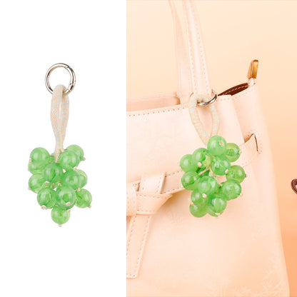Three-dimensional fruit bunch ornament for a bag