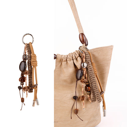 Natural wood bead charm with a soft tassel