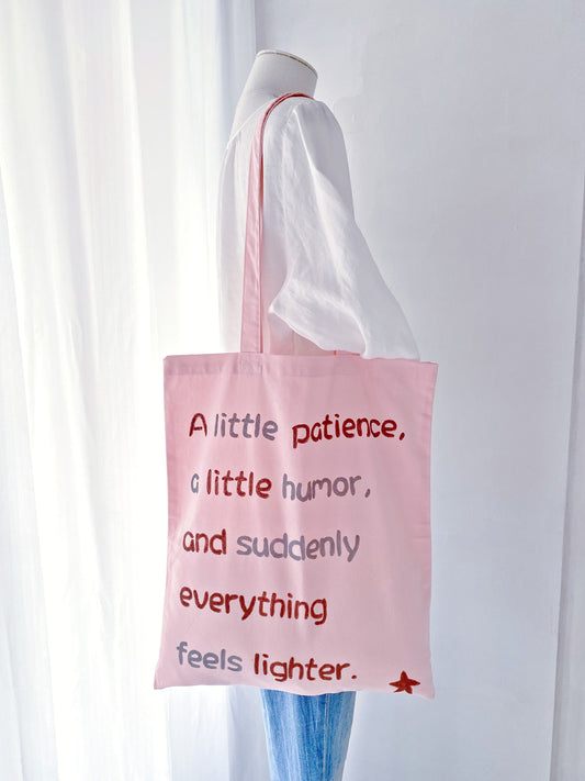 Pink cotton tote bag with a unique handwritten message, ideal for gifting or daily errands, with an emphasis on sustainability.
