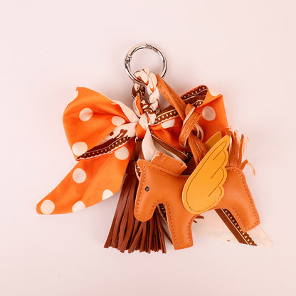 Orange scarf bow key holder with a handmade tassel