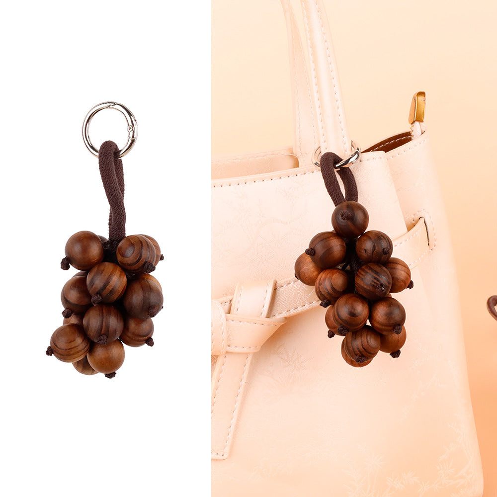 Grape-themed hanging detail for a backpack