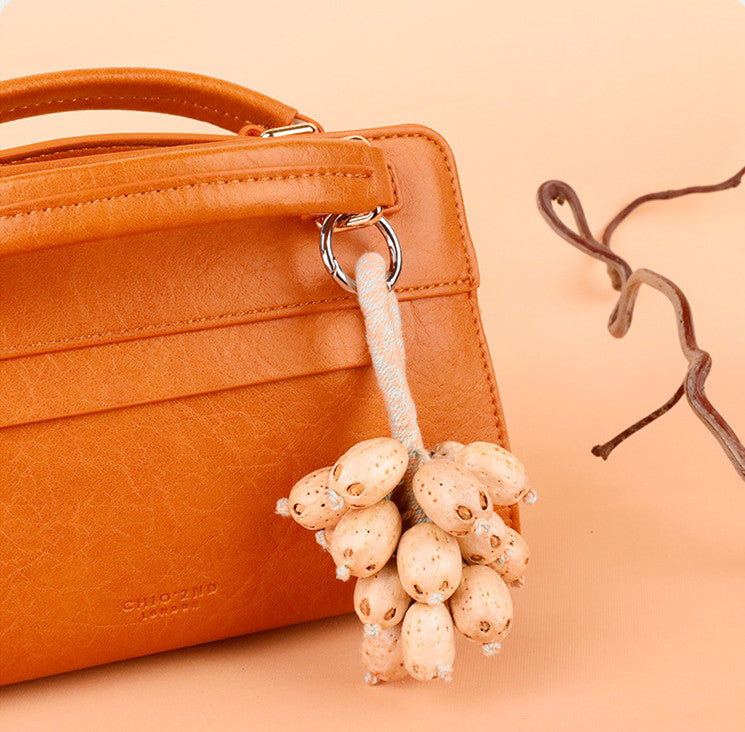 Fruit-shaped hanging decoration for a purse