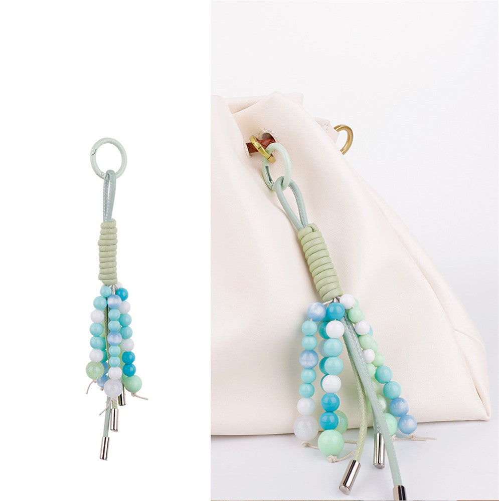 Unique green bag pendant made with natural stone beads