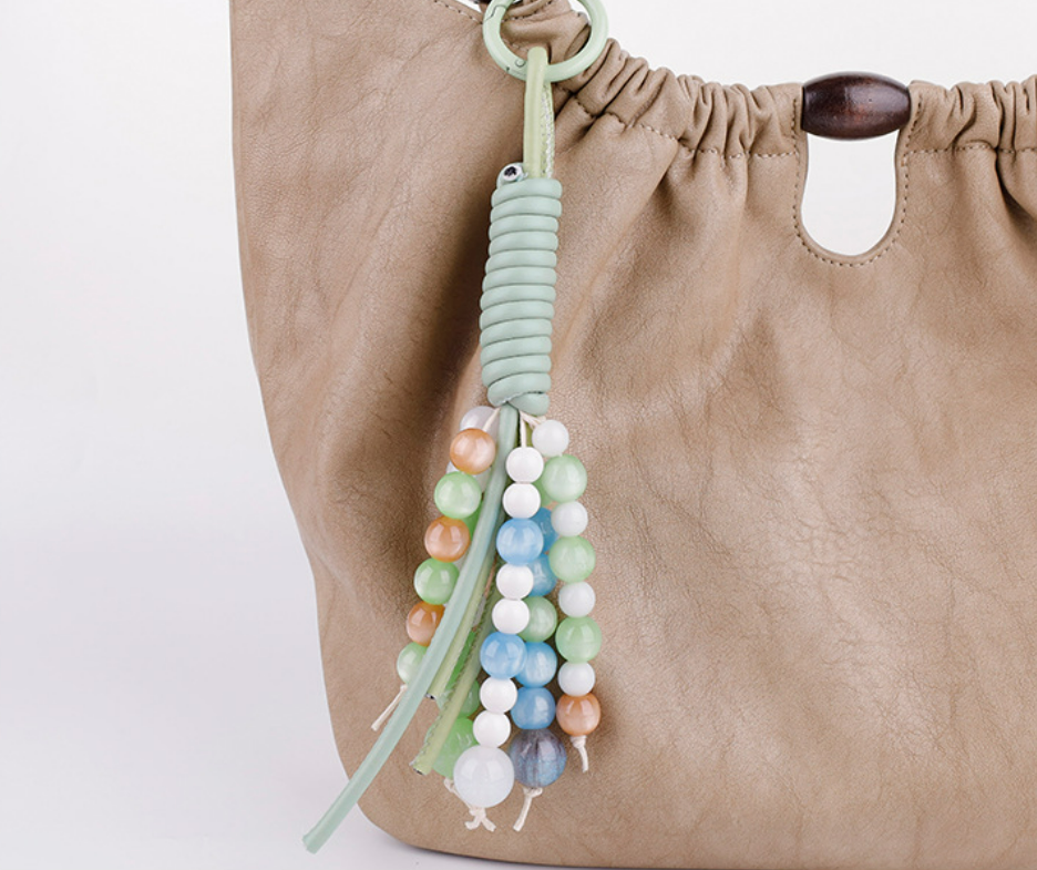 Hand-braided stone accessory for a canvas tote bag