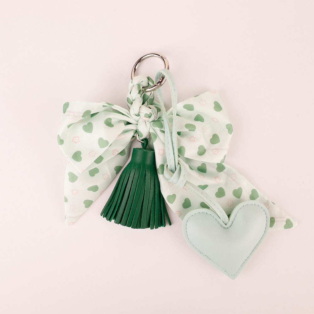 Aesthetic bow bag pendant in deep forest green color scheme