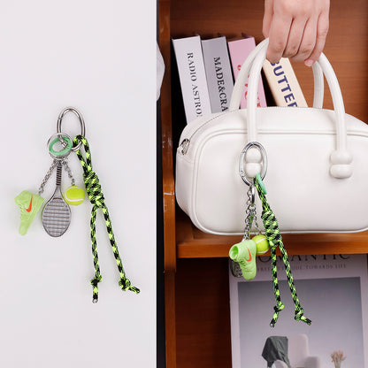 Green charm attached to a roomy tote for daily use