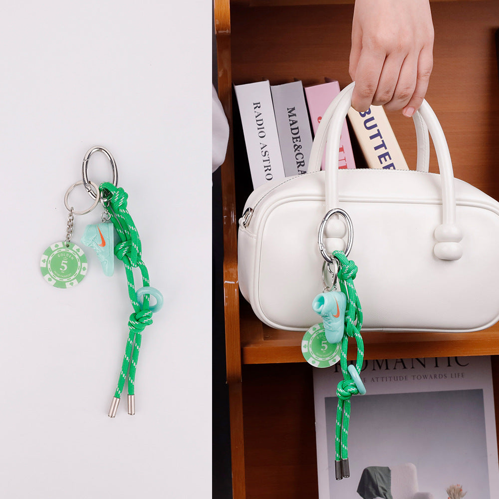 Handmade green bag accessory for a simple backpack