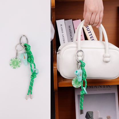 Handmade green bag accessory for a simple backpack