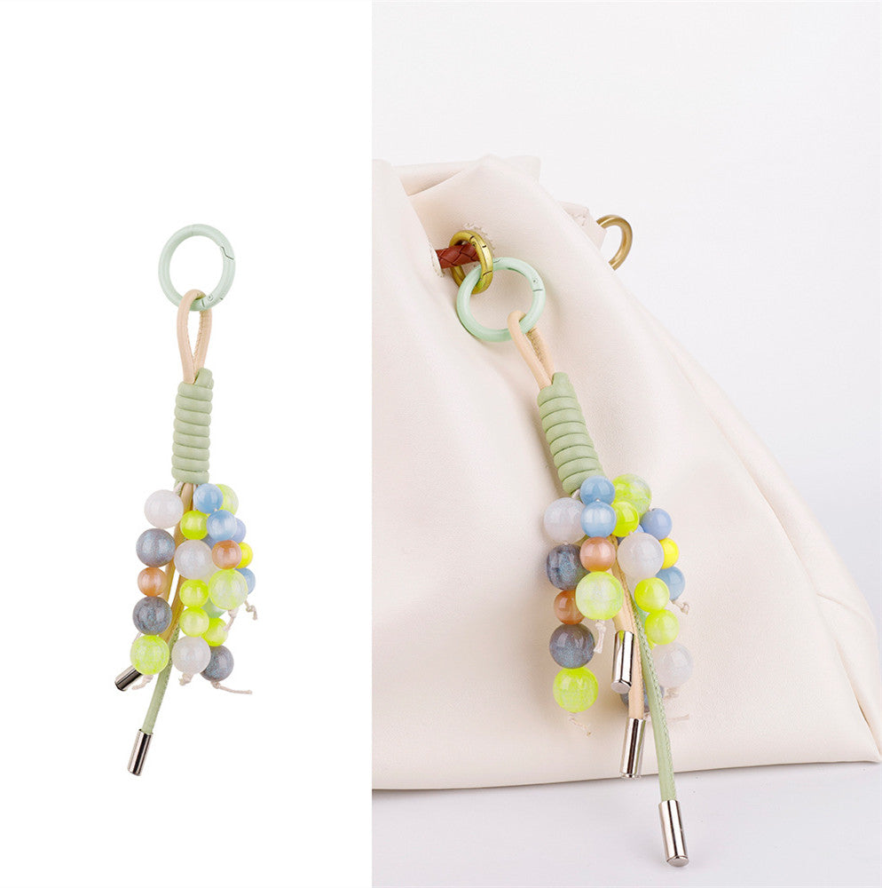 Handcrafted stone charm adding detail to a plain tote