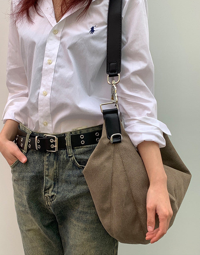 Minimalist canvas sling purse for daily essentials on the go