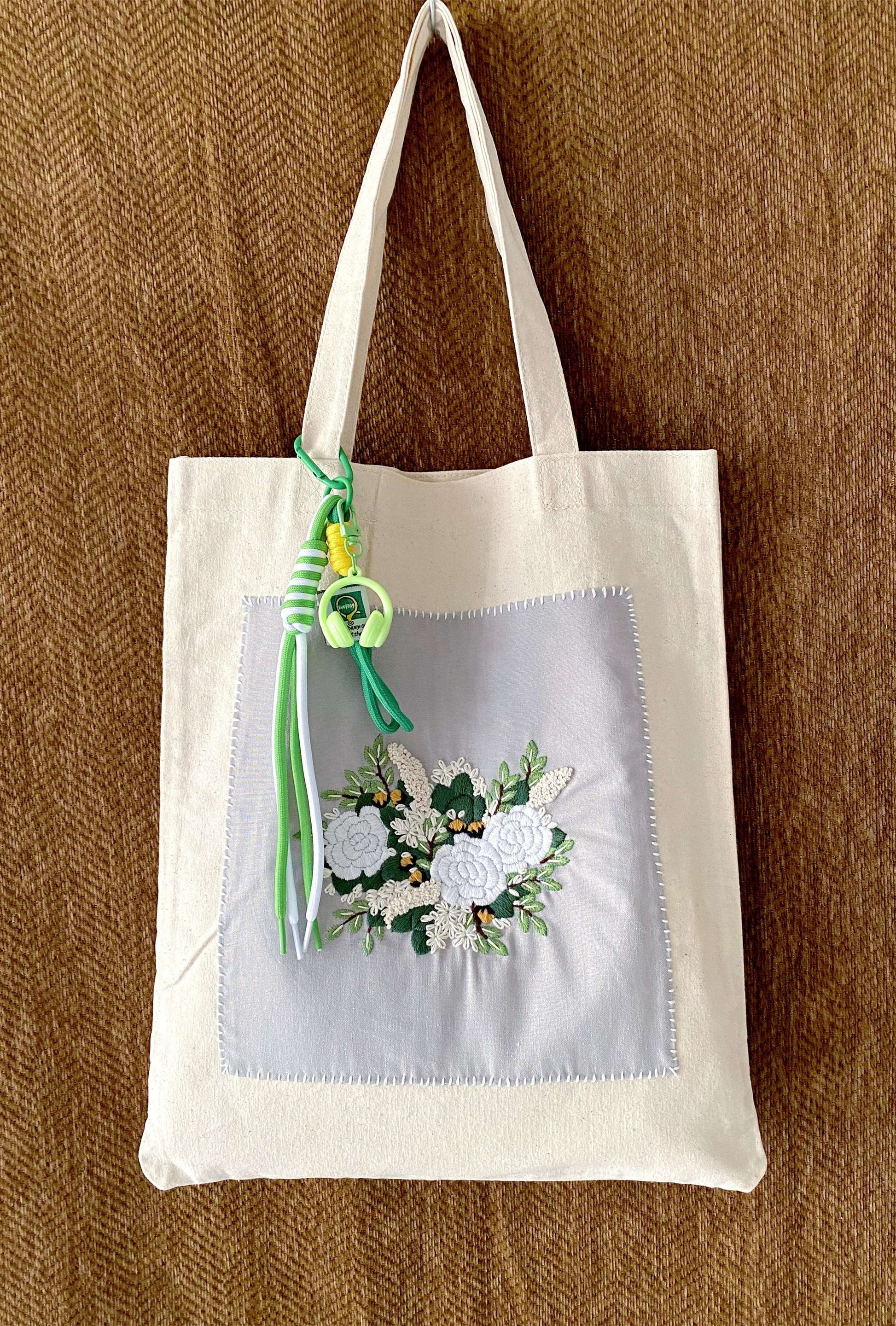 Artistic linen carryall with original hand-embroidery, a creative gift for the free-spirited woman.