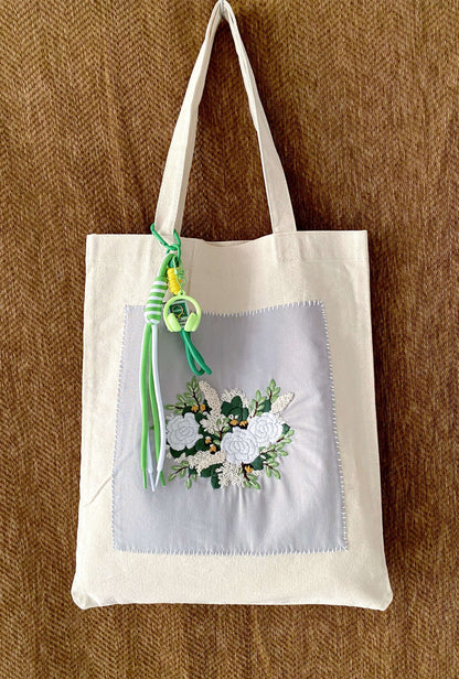 Artistic linen carryall with original hand-embroidery, a creative gift for the free-spirited woman.