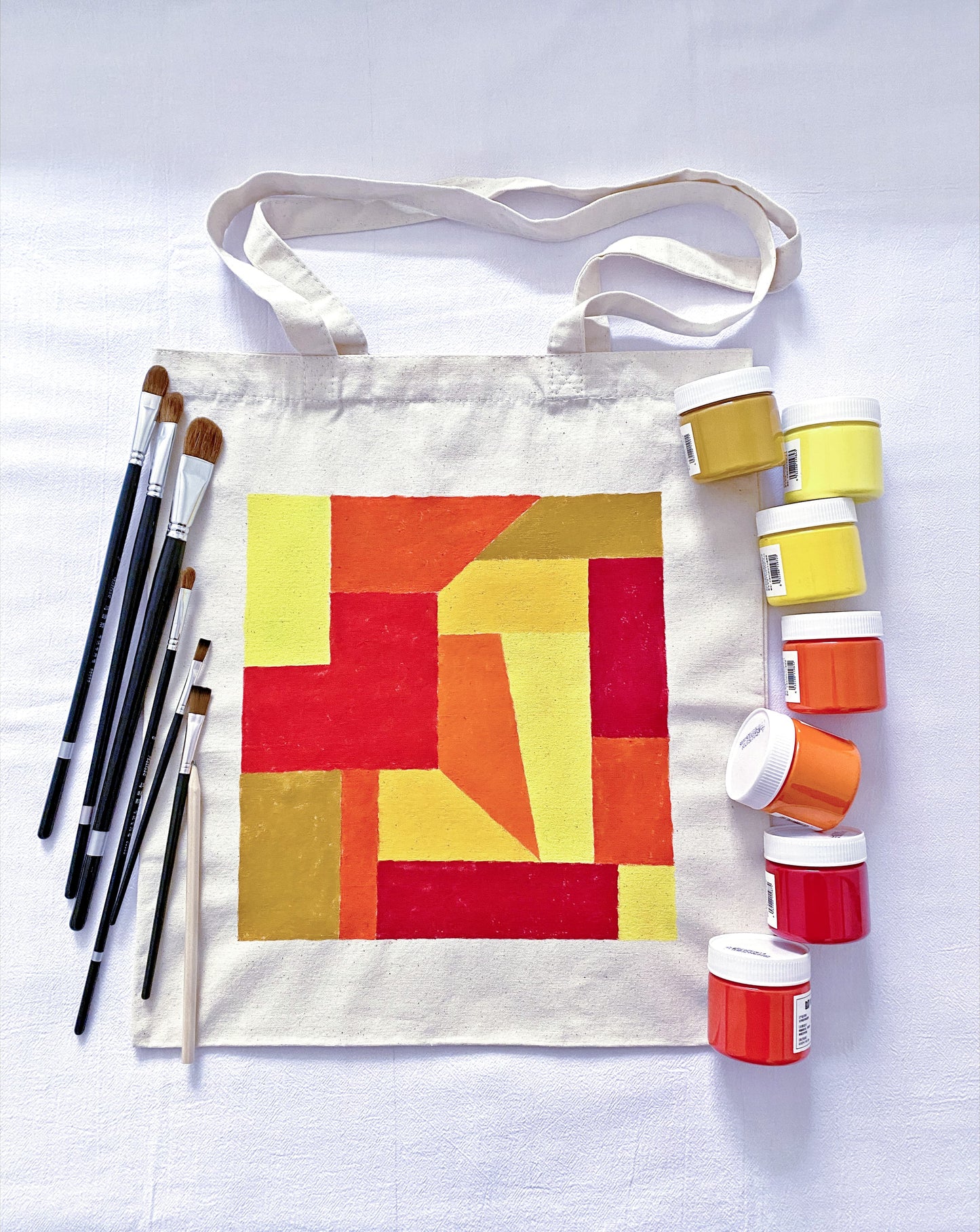 Interior view showing a laptop and books tucked into a spacious canvas bag.