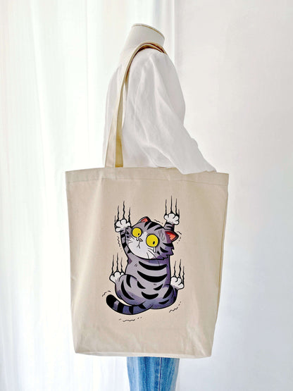 durable everyday tote bag featuring a surprised cat design