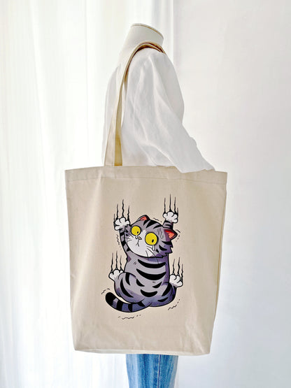 durable everyday tote bag featuring a surprised cat design