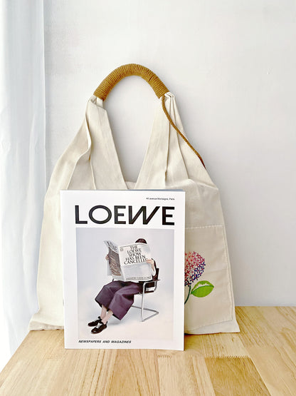 Lightweight and durable canvas shoulder bag with floral embroidery.