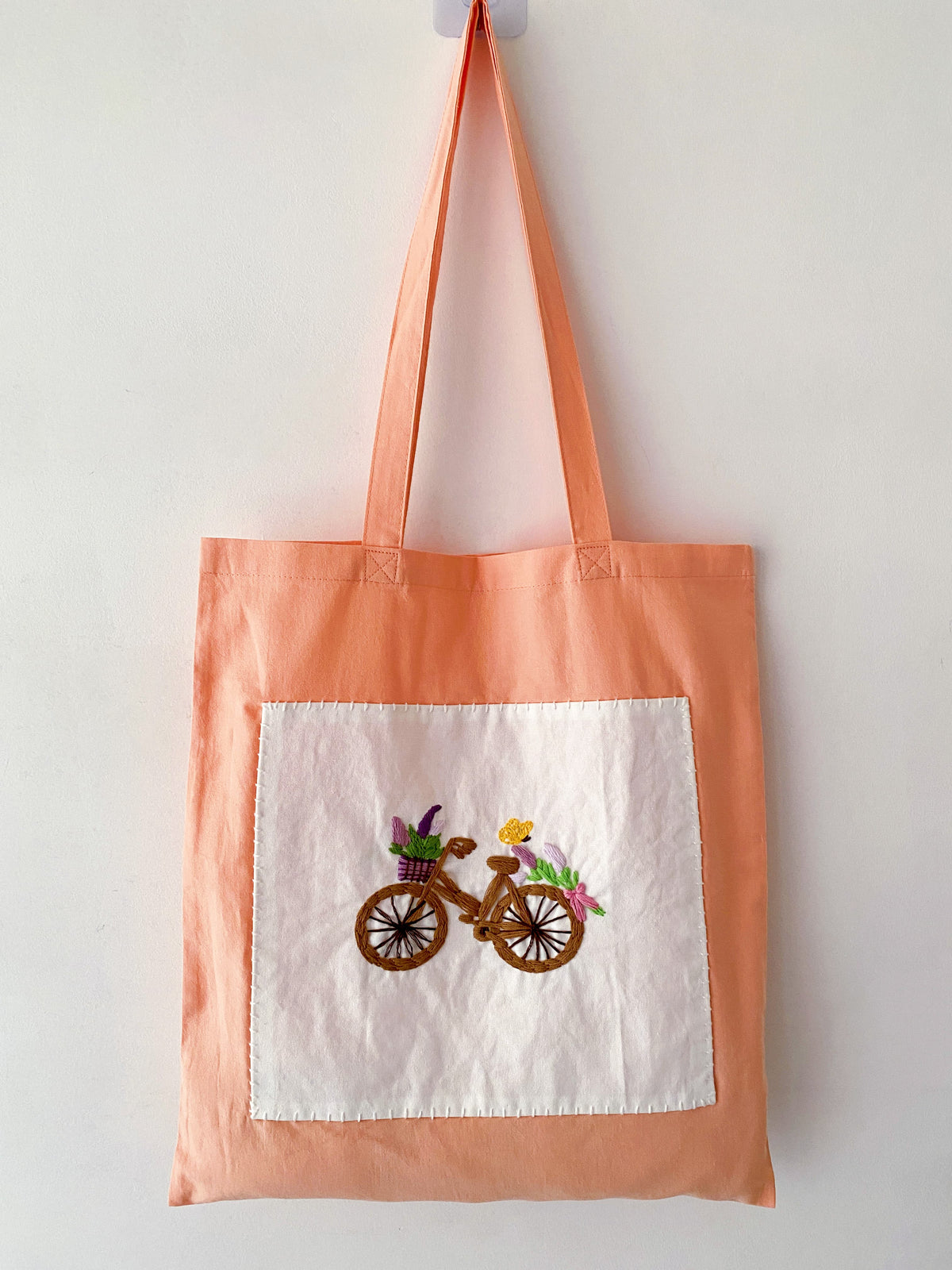 Hand-embroidered orange cotton tote chosen as a birthday present for a sister