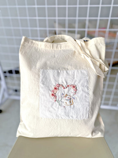 Show me a fashionable, large bag made from natural, sustainable cotton.