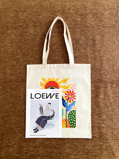 Hand printed tote included in a care package for a loved one.