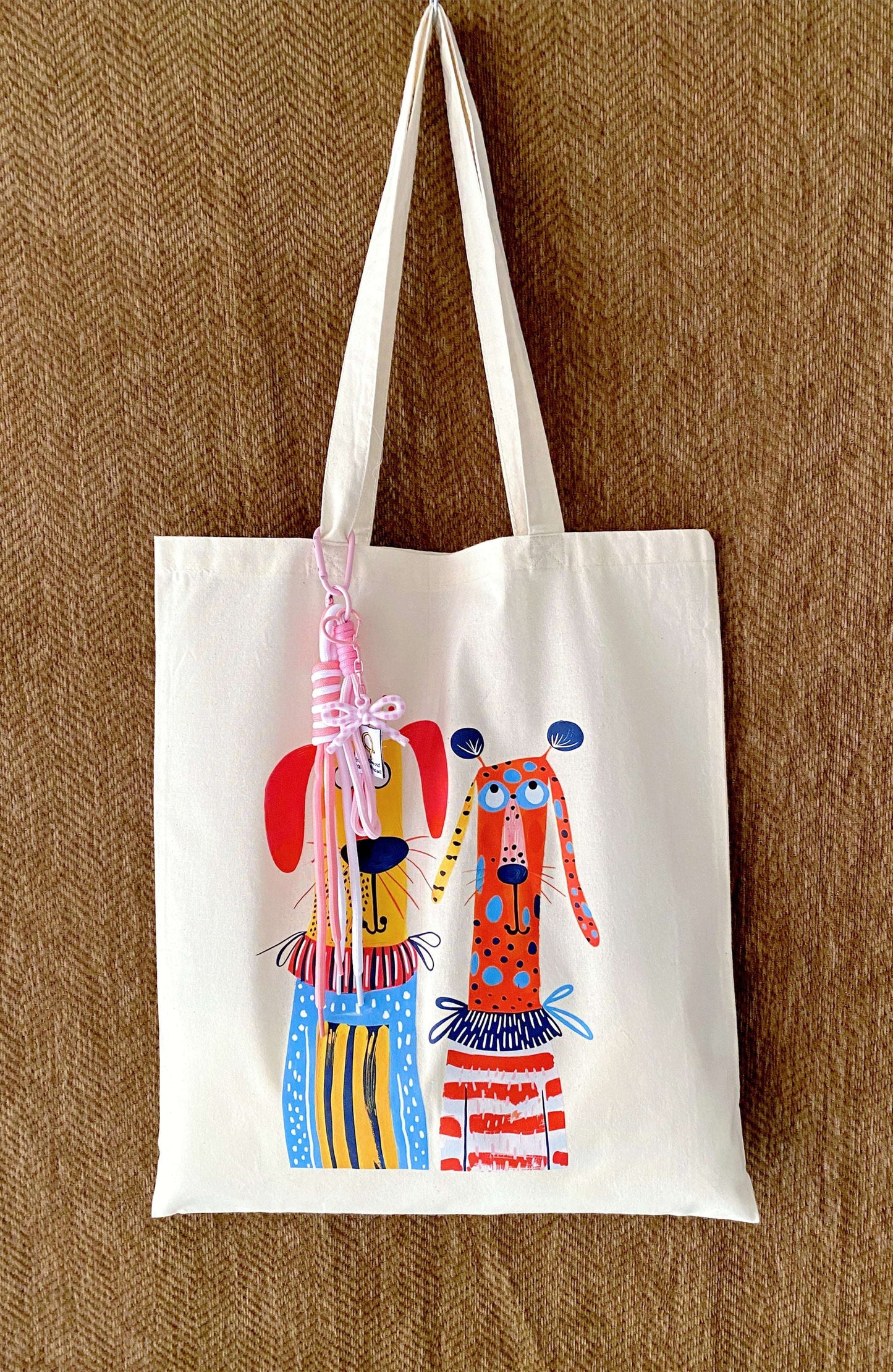 Large capacity tote filled with a laptop, a thick sweater, and a bottle.