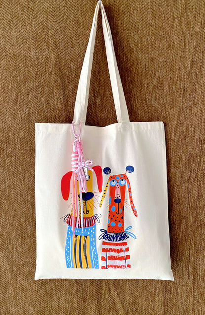 Large capacity tote filled with a laptop, a thick sweater, and a bottle.