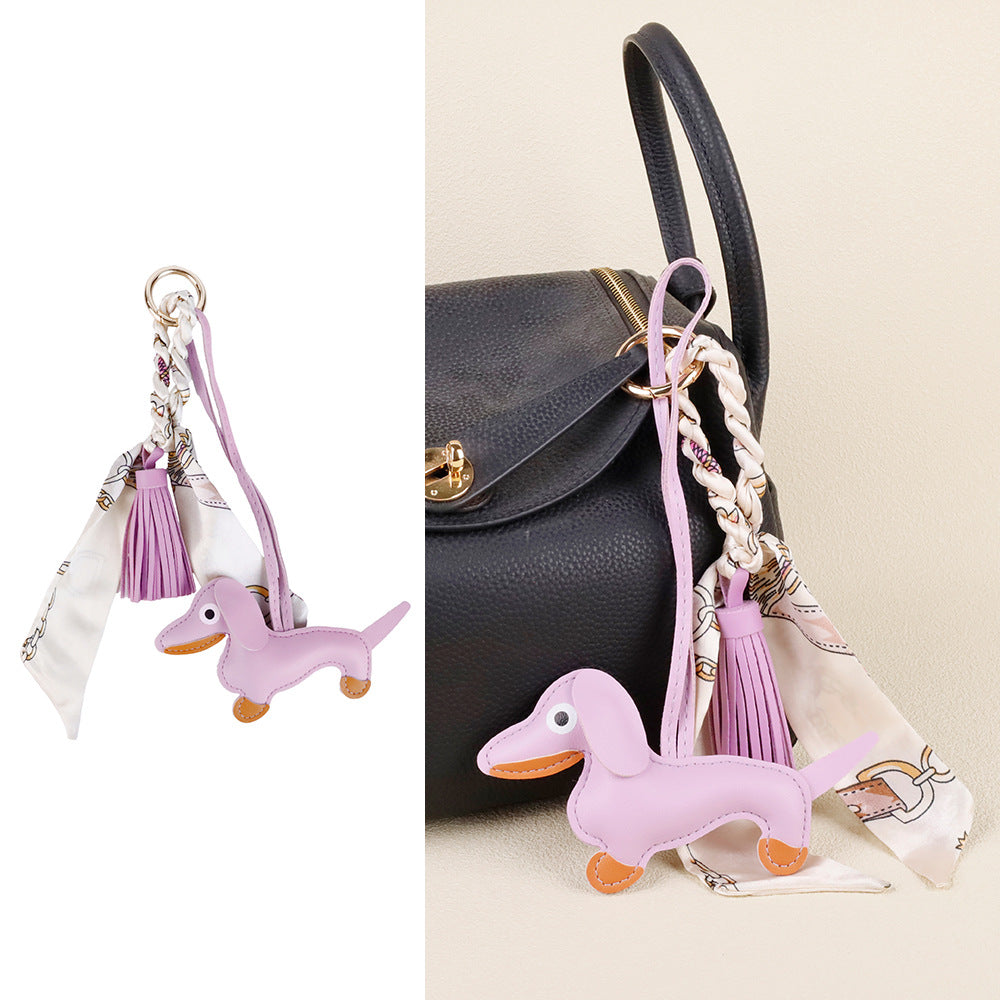 Leather dachshund purse clip attached to a designer everyday tote