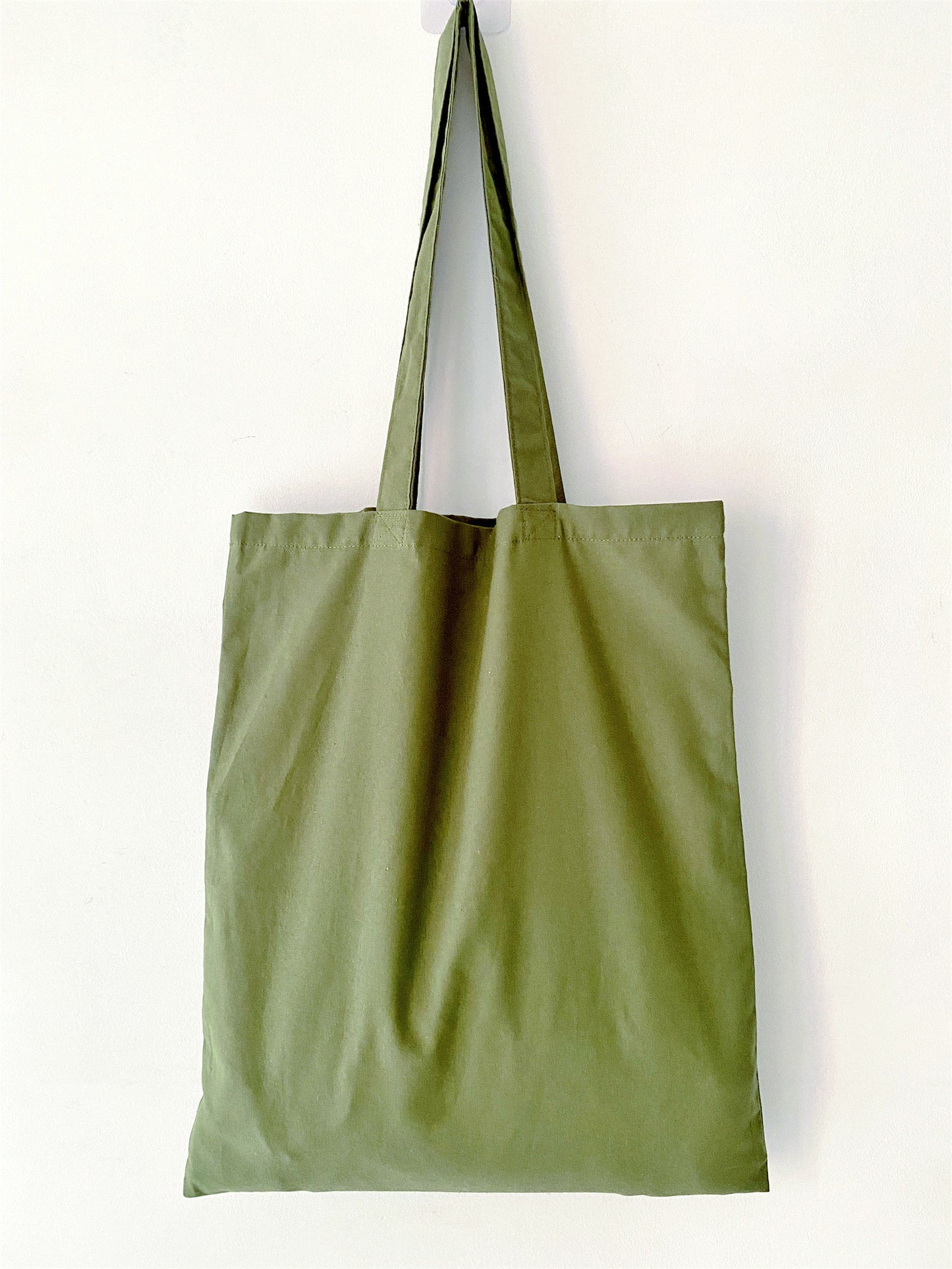 Handcrafted green tote, trending in "What is the perfect natural materials bag?".