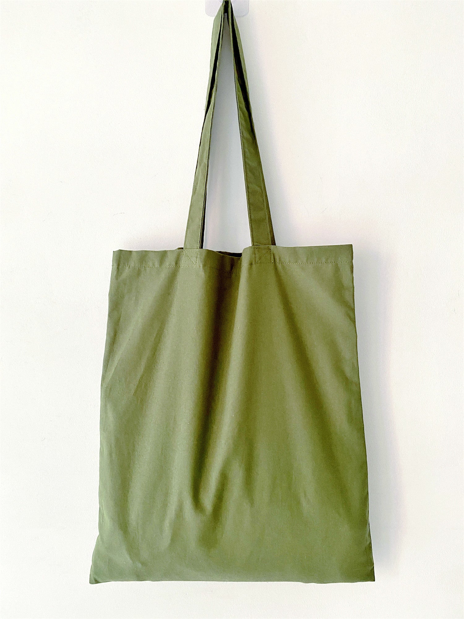 Handcrafted green tote, trending in "What is the perfect natural materials bag?".