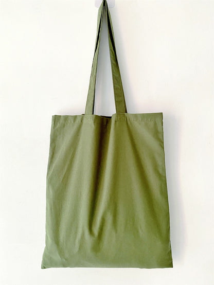 Handcrafted green tote, trending in "What is the perfect natural materials bag?".