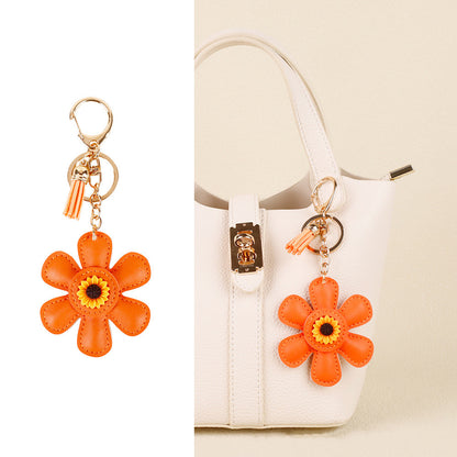 Sunflower charm and tassel detail for a handbag handle