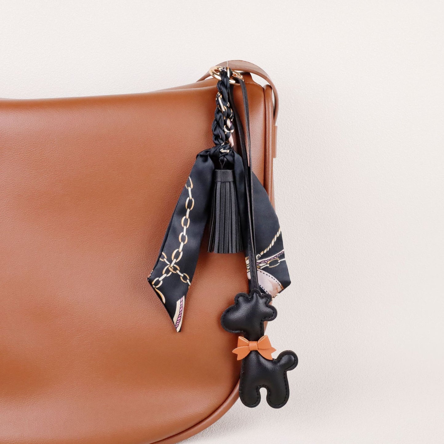 A stylish animal accent attached to a handbag handle