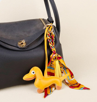 Artisanal leather dog charm for handbag styling and key organization