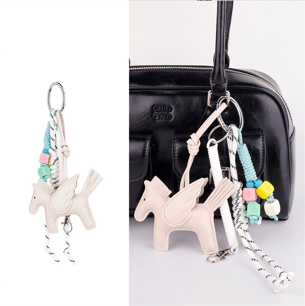 Detailed view of horse bag accent with dangling tassel detail