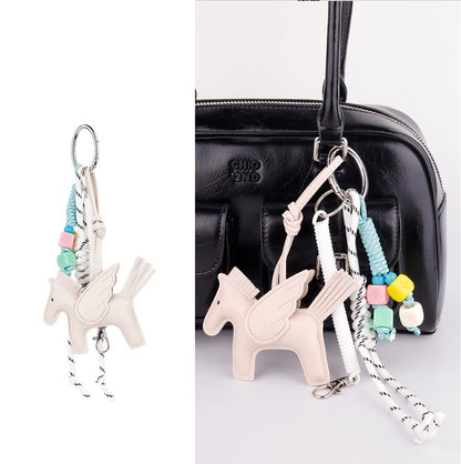 Detailed view of horse bag accent with dangling tassel detail