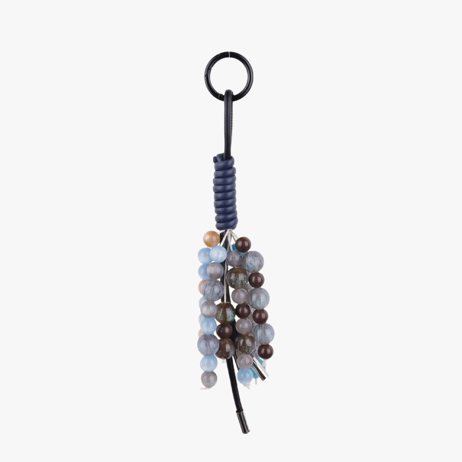 Aesthetic purple natural stone bag charm attached to a canvas tote bag