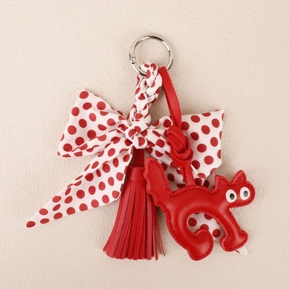 Polka dot scarf bow charm with tassels for a backpack