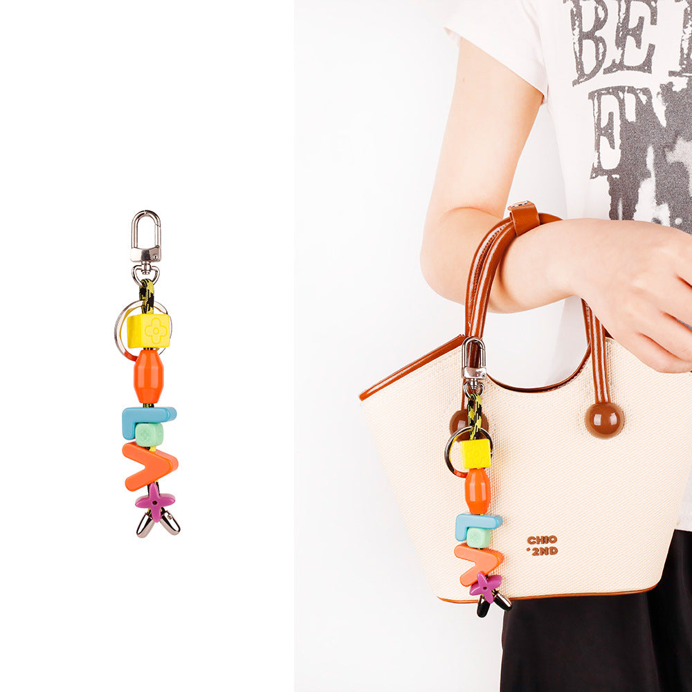 Personalized resin bag jewel for college student tote